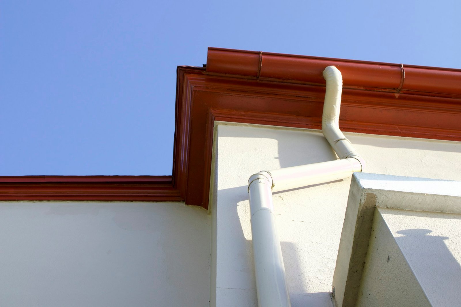 Gutter and downspout system attached to a house