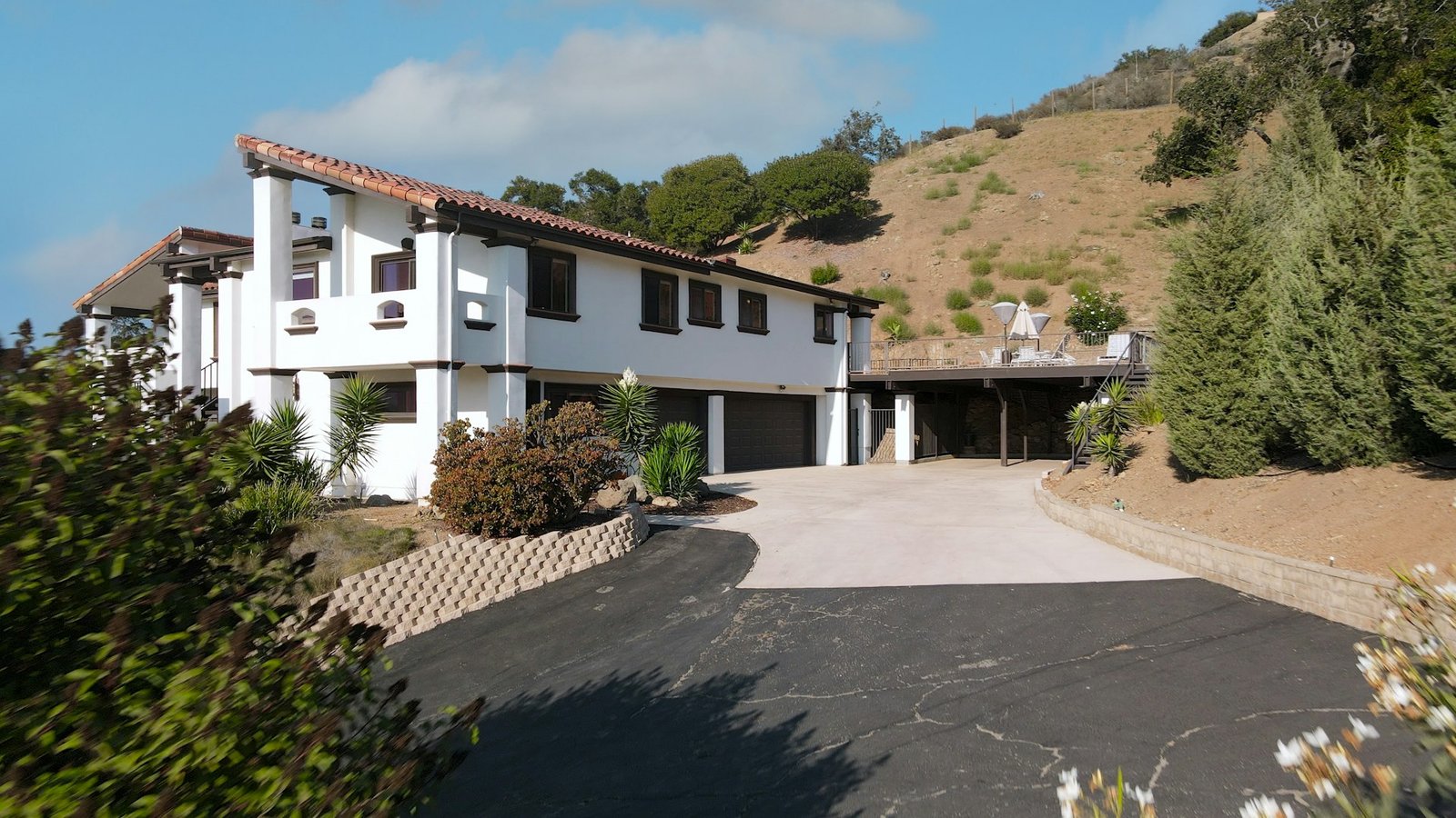 Large home with a paved driveway